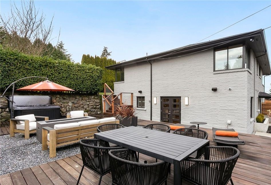 Backyard deck and outdoor living addition with seating and hot tub
