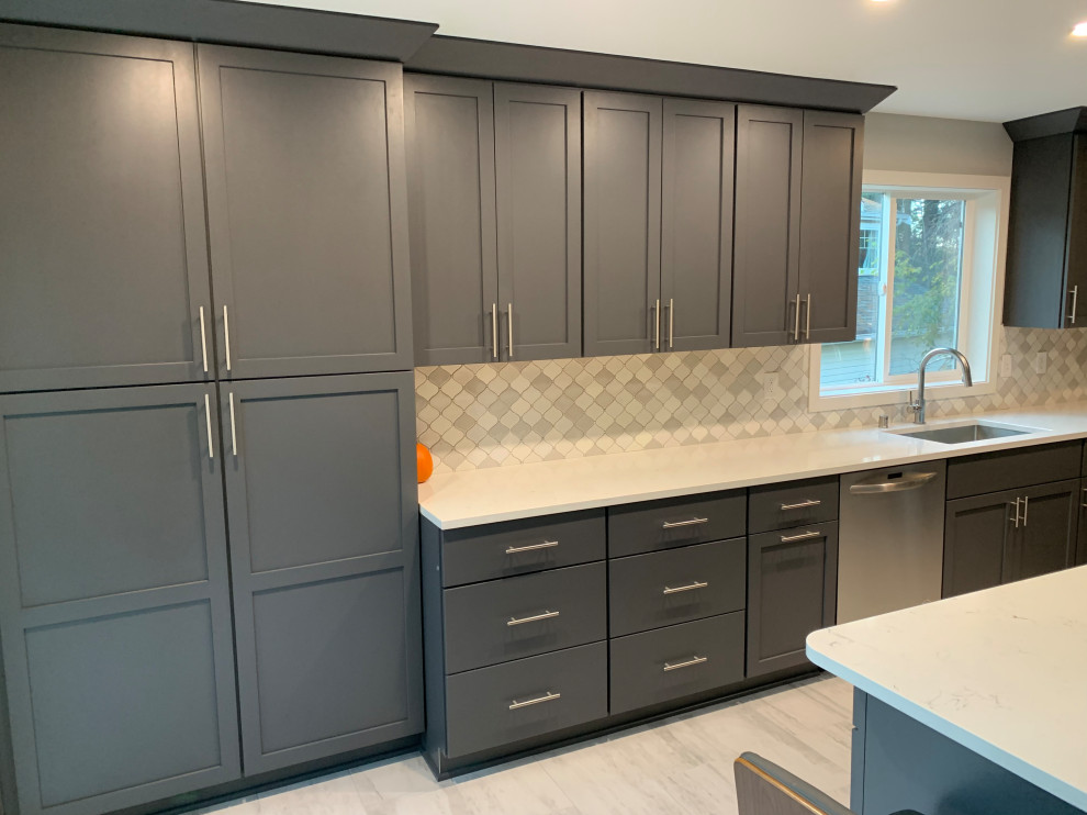 Tall charcoal pantry wall and lower drawers in Snohomish County kitchen remodel