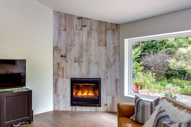 Reclaimed-wood fireplace feature wall with modern gas insert and garden window
