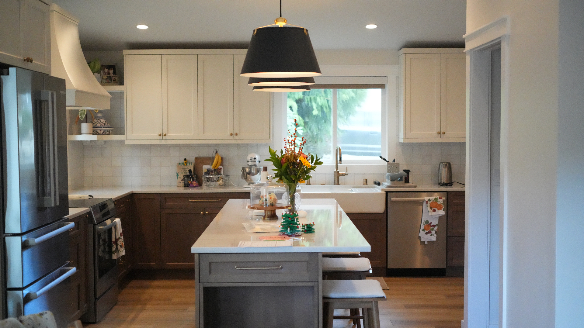 Bellevue kitchen remodel with long island, two-tone shaker cabinetry, and farmhouse sink