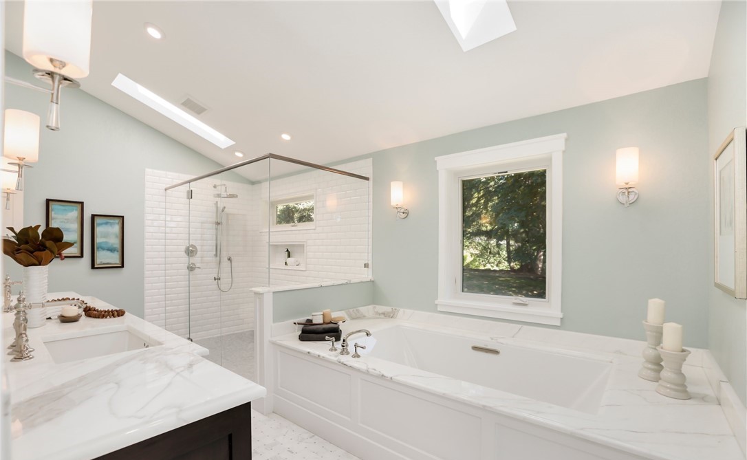 Spa bathroom material selection reference — marble counters and glass shower