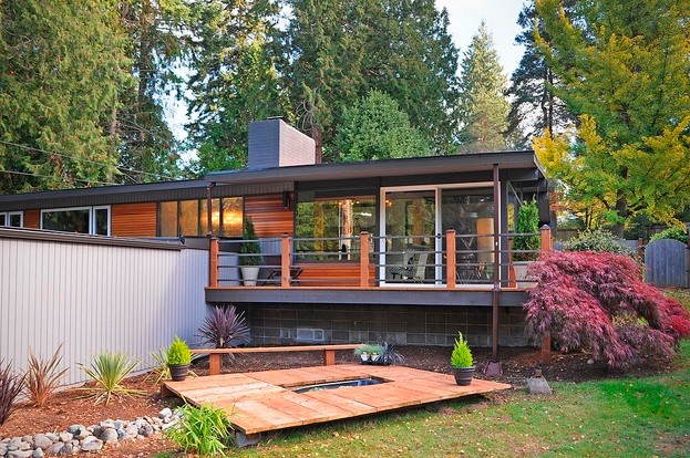 Mid-century home with new cedar siding and wraparound deck